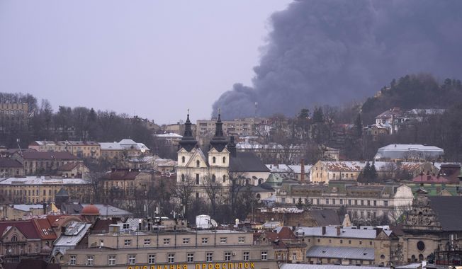 Smoke rises the air in Lviv, western Ukraine, Saturday, March 26, 2022. With Russia continuing to strike and encircle urban populations, from Chernihiv and Kharkiv in the north to Mariupol in the south, Ukrainian authorities said Saturday that they cannot trust statements from the Russian military Friday suggesting that the Kremlin planned to concentrate its remaining strength on wresting the entirety of Ukraine&#x27;s eastern Donbas region from Ukrainian control. (AP Photo/Nariman El-Mofty)