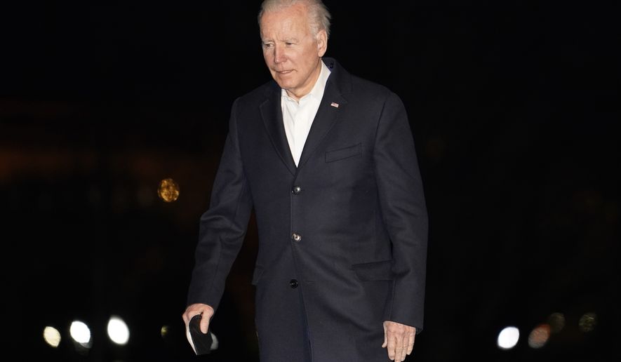 President Joe Biden walks to the White House after arriving on Marine One on the South Lawn, early Sunday, March 27, 2022, in Washington, after a four-day trip to Europe. (AP Photo/Carolyn Kaster)