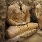 FILE - In this photograph made on Tuesday, Oct. 12, 2010 in Mes Aynak valley, south of Kabul, Afghanistan, Buddha statues are seen inside an ancient temple. The valley is the world&#39;s second-largest unexploited copper estimated to be worth nearly $1 trillion. (AP Photo/Dusan Vranic, File)