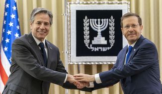U.S. Secretary of State Antony Blinken, left, and Israel&#39;s President Isaac Herzog pose for a photo as they meet at the Presidency, Sunday, March 27, 2022, in Jerusalem. (AP Photo/Jacquelyn Martin, Pool)