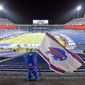 FILE - Buffalo Bills fans leave Bills Stadium as a mascot waves a flag after an NFL divisional round football game against the Baltimore Ravens, Jan. 16, 2021, in Orchard Park, N.Y. State and county taxpayers will be asked to commit $850 million in public funds toward construction of the Buffalo Bills&#39; new stadium, which has a state-projected price tag of $1.35 billion, a person familiar with the the plan told The Associated Press on Monday, March 28, 2022. (AP Photo/Adrian Kraus, File)