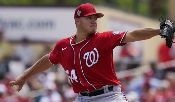 Washington Nationals&#39; Cade Cavalli pitches in the first inning of a spring training baseball game against the St. Louis Cardinals, Friday, March 25, 2022, in Jupiter, Fla. (AP Photo/Sue Ogrocki) **FILE**