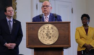 Gov. Larry Hogan (center) stands with Senate President Bill Ferguson and House Speaker Adrienne Jones during a news conference on Friday, March 18, 2022, in Annapolis, Md., where a 30-day gas tax suspension was announced. On Monday, March 28, 2022, they announced a $1.86 billion tax-relief agreement over five years for Maryland retirees, small businesses and low-income families. (AP Photo/Brian Witte)