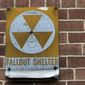 A fallout shelter sign hangs on a building on East 9th Street in New York, Jan. 16, 2018. (AP Photo/Mary Altaffer, File)