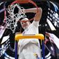 Kansas&#39; Mitch Lightfoot cuts down the net after a college basketball game in the Elite 8 round of the NCAA tournament Sunday, March 27, 2022, in Chicago. Kansas won 76-50 to advance to the Final Four. (AP Photo/Nam Y. Huh) **FILE**