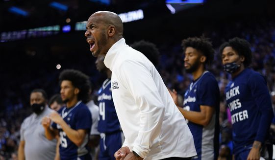 St. Peter&#x27;s head coach Shaheen Holloway reacts during the first half of a college basketball game against North Carolina in the Elite 8 round of the NCAA tournament, Sunday, March 27, 2022, in Philadelphia. (AP Photo/Chris Szagola) **FILE**