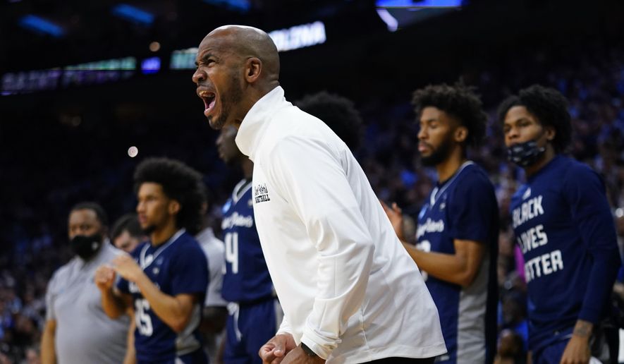 St. Peter&#39;s head coach Shaheen Holloway reacts during the first half of a college basketball game against North Carolina in the Elite 8 round of the NCAA tournament, Sunday, March 27, 2022, in Philadelphia. (AP Photo/Chris Szagola) **FILE**