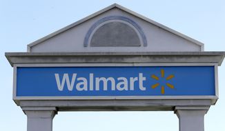 In this Sept. 3, 2019, file photo, a Walmart logo forms part of a sign outside a Walmart store, in Walpole, Mass. Walmart Inc. will no longer be selling cigarettes in some U.S. stores, a complicated move since tobacco is a money driver for many retailers. The nation&#x27;s largest retailer, based in Bentonville, Arkansas, said the removal is on a store-by-store decision based on the business and particular market. (AP Photo/Steven Senne, File)