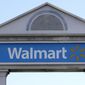 In this Sept. 3, 2019, file photo, a Walmart logo forms part of a sign outside a Walmart store, in Walpole, Mass. Walmart Inc. will no longer be selling cigarettes in some U.S. stores, a complicated move since tobacco is a money driver for many retailers. The nation&#39;s largest retailer, based in Bentonville, Arkansas, said the removal is on a store-by-store decision based on the business and particular market. (AP Photo/Steven Senne, File)