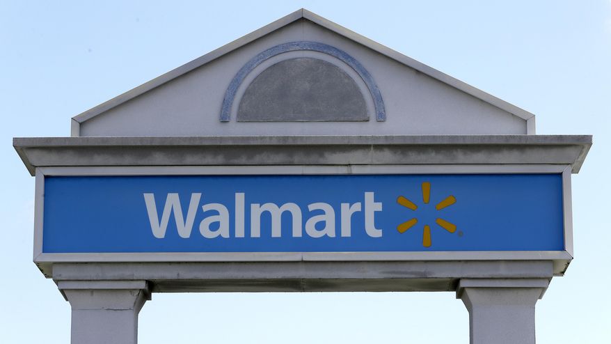 In this Sept. 3, 2019, file photo, a Walmart logo forms part of a sign outside a Walmart store, in Walpole, Mass. Walmart Inc. will no longer be selling cigarettes in some U.S. stores, a complicated move since tobacco is a money driver for many retailers. The nation&#39;s largest retailer, based in Bentonville, Arkansas, said the removal is on a store-by-store decision based on the business and particular market. (AP Photo/Steven Senne, File)