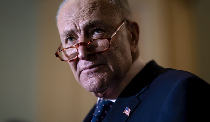 Senate Majority Leader Chuck Schumer, D-N.Y., meets with reporters asking about President Joe Biden's proposed $5.8 trillion budget, at the Capitol in Washington, Tuesday, March 29, 2022. (AP Photo/J. Scott Applewhite)