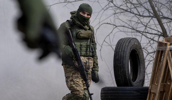 Ukrainian soldiers of the 103rd Separate Brigade of the Territorial Defense of the Armed Forces attend a training exercise at an undisclosed location near Lviv, western Ukraine, Tuesday, March 29, 2022. (AP Photo/Nariman El-Mofty)