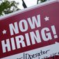 A &quot;now hiring&quot; sign is posted in Garnet Valley, Pa., Monday, May 10, 2021. Job openings stayed at a near-record level in February, 2022, little changed from the previous month, continuing a trend that Federal Reserve officials see as a driver of inflation. (AP Photo/Matt Rourke, File )