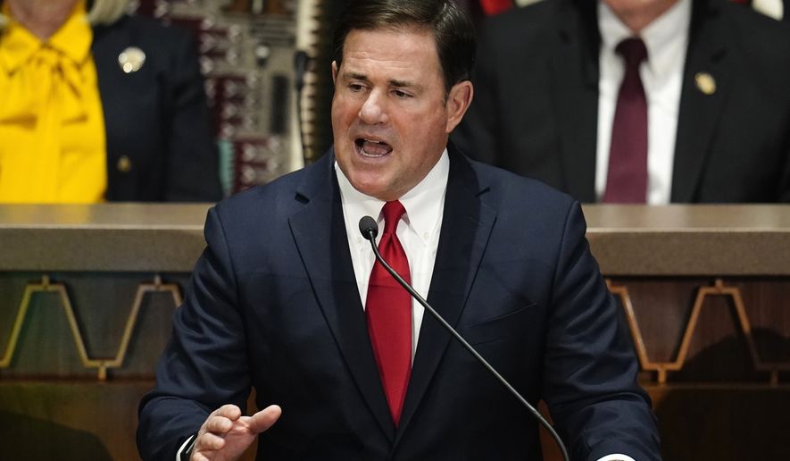Arizona Republican Gov. Doug Ducey gives his state of the state address at the Arizona Capitol, Monday, Jan. 10, 2022, in Phoenix. Governor Ducey signed a series of bills Wednesday, March 30, targeting abortion and transgender rights, joining a growing list of GOP-led states pursuing a conservative social agenda.  (AP Photo/Ross D. Franklin, File)