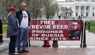 Joey and Paula Reed, parents of U.S. Marine Corps veteran and Russian prisoner Trevor Reed, stand in Lafayette Park near the White House, Wednesday, March 30, 2022, in Washington. The Reeds are urging President Joe Biden to advocate for their son&#39;s release from his nine-year prison term on charges alleging that he assaulted police officers in Moscow. (AP Photo/Patrick Semansky)