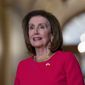 Speaker of the House Nancy Pelosi, D-Calif., stands as she welcomes Prime Minister Lee Hsien Loong of Singapore for talks at the Capitol in Washington, Wednesday, March 30, 2022. (AP Photo/J. Scott Applewhite)