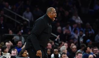 Georgetown coach Patrick Ewing calls out to the team after a shot clock violation during the first half of an NCAA college basketball game against Seton Hall at the Big East men&#39;s tournament Wednesday, March 9, 2022, in New York. Seton Hall won 57-53. (AP Photo/Frank Franklin II) **FILE**