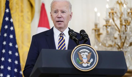 FILE - President Joe Biden speaks alongside Singapore&#39;s Prime Minister Lee Hsien Loong in the East Room of the White House, March 29, 2022, in Washington. The Biden administration is launching what it says is a one-stop website that will help people in the United States access COVID-19 tests, vaccines and treatments, along with status updates on infection rates where they live. (AP Photo/Patrick Semansky, File )