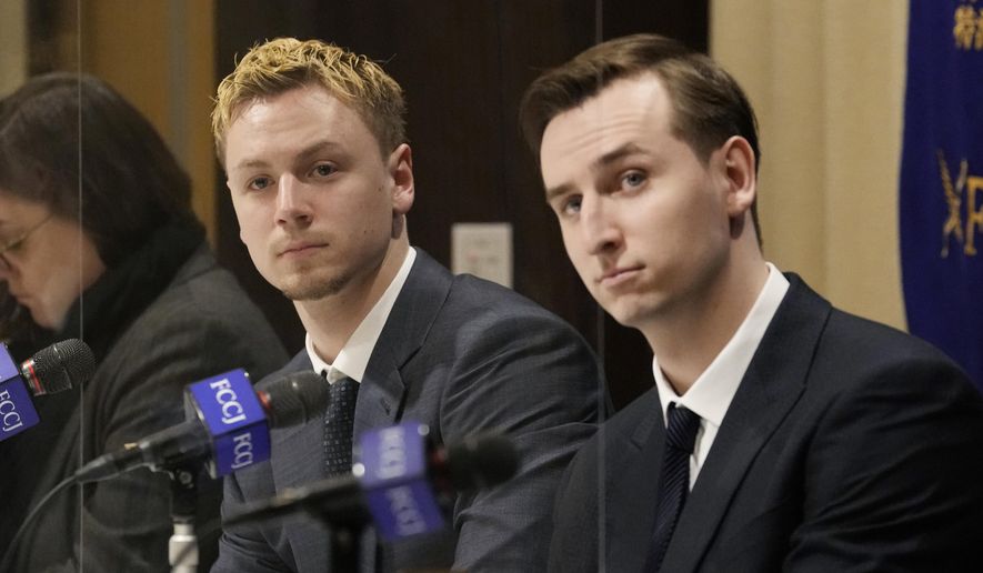 Ukraine&#39;s YouYubers Sava Tkachov, right, and his young brother Yan Tkachov attend a news conference at the Foreign Correspondents Club of Japan in Tokyo, Thursday, March 31, 2022. Ukrainian YouTuber duo Sawayan, popular among young Japanese for their funny videos and chat over Mario Kart games, are now using their platform to share the reality of war in Ukraine and send an antiwar message. (AP Photo/Shuji Kajiyama)
