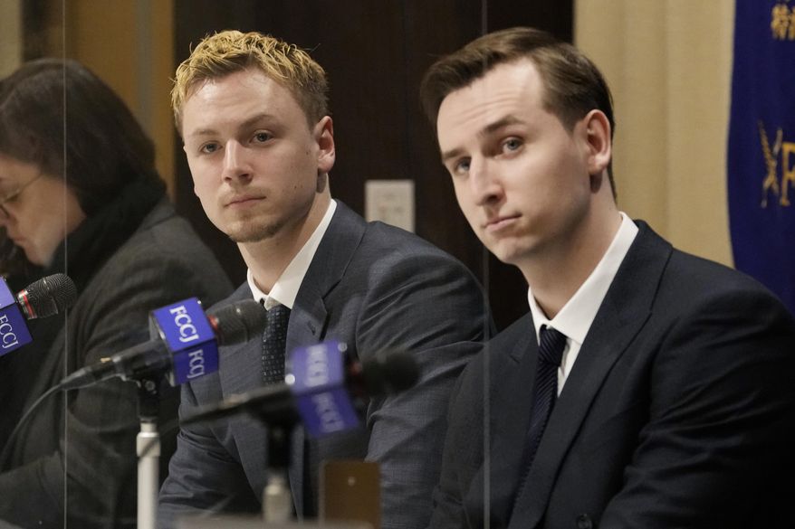 Ukraine&#39;s YouYubers Sava Tkachov, right, and his young brother Yan Tkachov attend a news conference at the Foreign Correspondents Club of Japan in Tokyo, Thursday, March 31, 2022. Ukrainian YouTuber duo Sawayan, popular among young Japanese for their funny videos and chat over Mario Kart games, are now using their platform to share the reality of war in Ukraine and send an antiwar message. (AP Photo/Shuji Kajiyama)