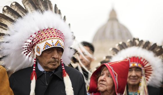 Former national chief of the Assembly of First Nations, Phil Fontaine, left, stands outside St. Peter&#39;s Square at the end of a meeting with Pope Francis at the Vatican, Thursday, March 31, 2022. (AP Photo/Andrew Medichini)