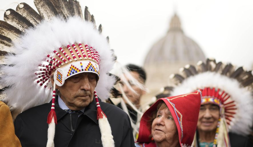 Former national chief of the Assembly of First Nations, Phil Fontaine, left, stands outside St. Peter&#x27;s Square at the end of a meeting with Pope Francis at the Vatican, Thursday, March 31, 2022. (AP Photo/Andrew Medichini)