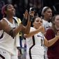 South Carolina&#x27;s Aliyah Boston cheers from the bench in the final seconds of the second half of a college basketball game in the semifinal round of the Women&#x27;s Final Four NCAA tournament Friday, April 1, 2022, in Minneapolis. (AP Photo/Charlie Neibergall)