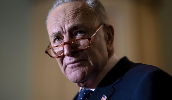 Senate Majority Leader Chuck Schumer, D-N.Y., meets with reporters asking about President Joe Biden&#39;s proposed $5.8 trillion budget, at the Capitol in Washington, Tuesday, March 29, 2022. (AP Photo/J. Scott Applewhite)