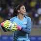 United States&#39; goalkeeper Hope Solo takes the ball during a women&#39;s soccer game at the Rio Olympics against New Zealand in Belo Horizonte, Brazil, Aug. 3, 2016. Former U.S. women’s national team star goalkeeper Solo was arrested after police say she was found passed out behind the wheel of a vehicle in North Carolina with her two children inside. A police report said Solo was arrested on Thursday, March 31, 2022, in a shopping center parking lot in Winston-Salem and charged with driving while impaired, resisting a public officer and misdemeanor child abuse. (AP Photo/Eugenio Savio, File)