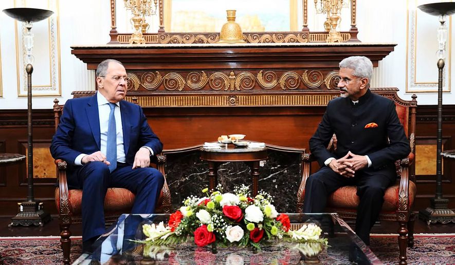 In this photo provided by Indian Foreign Minister S. Jaishankar&#x27;s Twitter handle, Jaishankar and his Russian counterpart Sergei Lavrov sit for a meeting in New Delhi, India, Friday, April 1, 2022. (Indian Foreign Minister S. Jaishankar&#x27;s Twitter handle via AP)