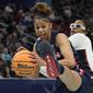 UConn&#39;s Evina Westbrook grabs a ball in front of Stanford&#39;s Francesca Belibi during the first half of a college basketball game in the semifinal round of the Women&#39;s Final Four NCAA tournament Friday, April 1, 2022, in Minneapolis. (AP Photo/Eric Gay)