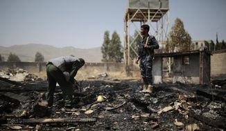 FILE - Yemeni police inspect a site of Saudi-led airstrikes targeting two houses in Sanaa, Yemen, Saturday, March 26, 2022.   Yemen&#39;s warring sides have accepted a two-month truce, starting with the Muslim holy month of Ramadan, the U.N. envoy to Yemen said Friday, April 1.  The envoy, Hans Grundberg, announced the agreement from Amman, Jordan, after meeting separately with both sides in the country&#39;s brutal civil war in recent days. He said that he hoped the truce would be renewed after two months. (AP Photo/Hani Mohammed, File)