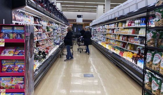 Customers shop at a grocery store in Mount Prospect, Ill., Friday, April 1, 2022. USDA says the food inflation rate to soar, the highest since 2008. (AP Photo/Nam Y. Huh) ** FILE **