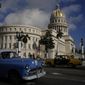 A vintage Russian-made Lada car, right, and an American-made classic car drive past the Capitol in Havana, Cuba, Friday, April 1, 2022. Global restrictions on transport and trade with Russia after its invasion of Ukraine pose a serious problem for Cubans because much of the island&#39;s fleets of trucks, buses, cars and tractors came from distant Russia and are now aging and in need of parts. (AP Photo/Ramon Espinosa)