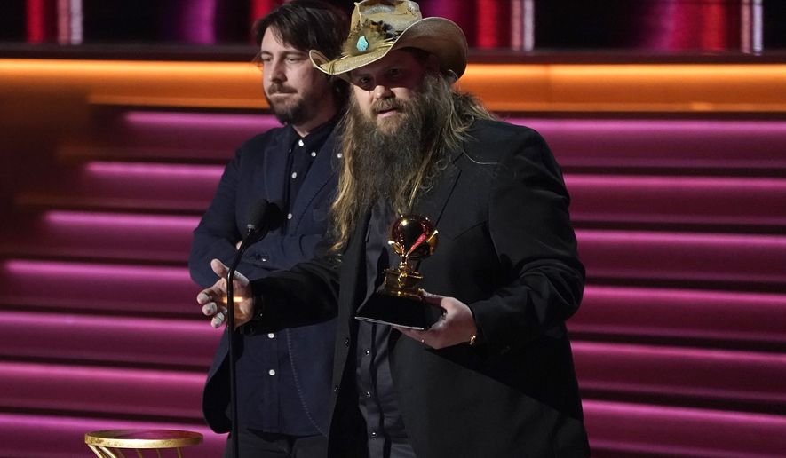 Chris Stapleton, right, and Dave Cobb accept the award for best country album for &quot;Starting Over&quot; at the 64th Annual Grammy Awards on Sunday, April 3, 2022, in Las Vegas. (AP Photo/Chris Pizzello)