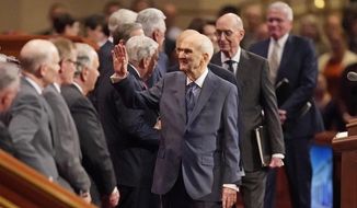 The Church of Jesus Christ of Latter-day Saints President Russell M. Nelson, center, waves as he arrives during the Church of Jesus Christ of Latter-day Saints&#39; twice-annual church conference Saturday, April 2, 2022, in Salt Lake City. Top leaders of the Church of Jesus Christ of Latter-day Saints addressed a wide range of topics at their conference, including LGBTQ non-discrimination laws, war in Ukraine and political polarization. (AP Photo/Rick Bowmer)