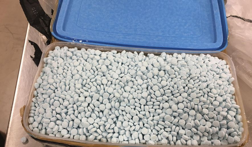 This August 2017 photo provided by the U.S. Drug Enforcement Administration&#x27;s Phoenix Division shows one of four containers holding some of the 30,000 fentanyl pills the agency seized in one of its bigger busts in Tempe, Ariz. As the number of U.S. overdose deaths continues to soar, states are trying to take steps to combat a flood of the drug that has proved the most lethal — illicitly produced fentanyl. (Drug Enforcement Administration via AP) **FILE**
