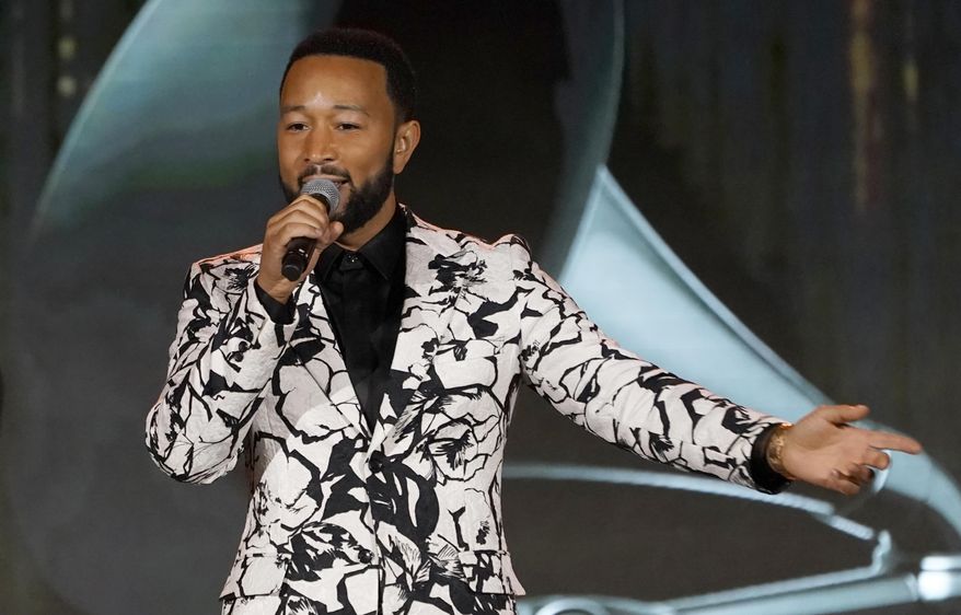 John Legend accepts the Global Impact Award at the Recording Academy Honors Presented By The Black Music Collective on Saturday, April 2, 2022, at Resorts World Las Vegas. (AP Photo/Chris Pizzello)