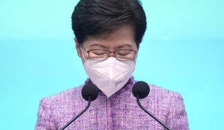 Hong Kong Chief Executive Carrie Lam pauses during a news conference in Hong Kong, Monday, April 4, 2022. Lam, who survived massive protests against her government in 2019 and oversaw the implementation of a tough national security law that quashed dissent, said Monday she will not seek a second term. Her successor will be picked in May. (AP Photo/Vincent Yu, Pool)