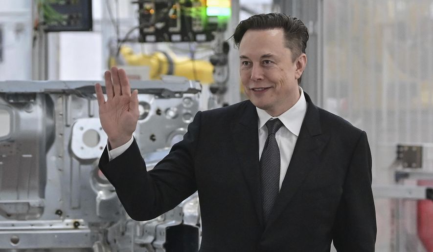 Tesla CEO Elon Musk attends the opening of the Tesla factory Berlin Brandenburg in Gruenheide, Germany, Tuesday, March 22, 2022. Elon Musk is taking a 9.2% stake in Twitter. Musk purchased approximately 73.5 million shares, according to a regulatory filing. (Patrick Pleul/Pool via AP, File)