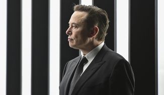 Elon Musk, Tesla CEO, attends the opening of the Tesla factory Berlin Brandenburg in Gruenheide, Germany, March 22, 2022. Musk, who is now Twitter&#39;s largest shareholder and newly appointed board member, may have thoughts on a long-standing request from users: Should there be an edit button? On Monday evening, Musk launched a Twitter poll about whether they want an edit button. More than 3 million people have voted as of Tuesday, April 5, 2022. The poll closes Tuesday evening Eastern time. (Patrick Pleul/Pool via AP)