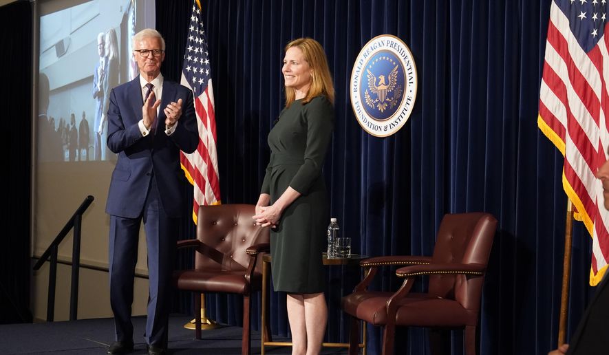 U.S. Supreme Court Associate Justice Amy Coney Barrett smiles after a public conversation with Board of Trustees Chairman Frederick J. Ryan, Jr., at the Ronald Reagan Presidential Library Foundation in Simi Valley, Calif., Monday, April 4, 2022. (AP Photo/Damian Dovarganes)