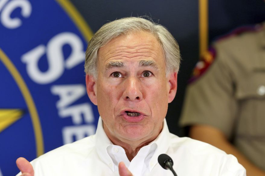 Texas Governor Greg Abbott answers questions during a press conference at the Texas Department of Public Safety Weslaco Regional Office on Wednesday, April 6, 2022, in Weslaco, Texas. Abbott says the state will provide migrants arriving at the U.S.-Mexico border bus charters to Washington, D.C. The move announced Wednesday amounts to a taunt at President Joe Biden and Congress over what the Republican governor calls a failure by the federal government to stop the flow of migrants coming to the southern border.  (Joel Martinez/The Monitor via AP)