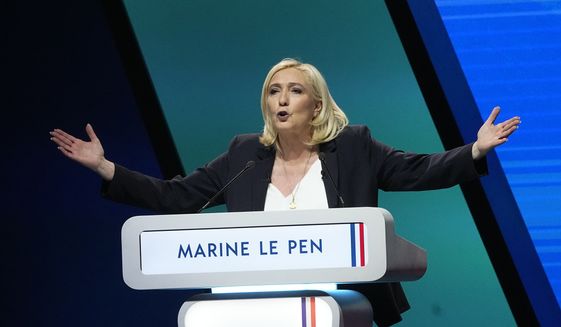 French far-right leader Marine Le Pen delivers a speech during a campaign rally, Feb. 5, 2022 in Reims, eastern France. Marine Le Pen, 53, is considered Macron&#39;s main challenger. Le Pen&#39;s plans include the end of family reunification, restricting social benefits to the French only, deporting foreigners who stay unemployed for over a year and other migrants who entered illegally in the country. (AP Photo/Michel Euler, File)