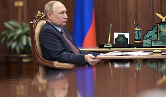 Russian President Vladimir Putin attends a meeting in the Kremlin in Moscow, Russia, Wednesday, April 6, 2022. (Mikhail Klimentyev, Sputnik, Kremlin Pool Photo via AP)