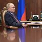 Russian President Vladimir Putin attends a meeting in the Kremlin in Moscow, Russia, Wednesday, April 6, 2022. (Mikhail Klimentyev, Sputnik, Kremlin Pool Photo via AP)