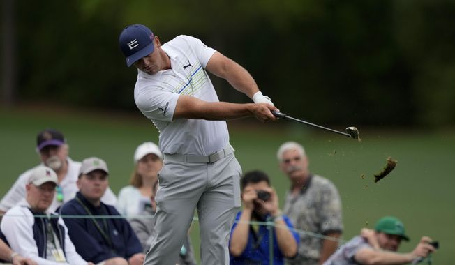 Bryson DeChambeau hits on the 12th tee during a practice round for the Masters golf tournament on Wednesday, April 6, 2022, in Augusta, Ga. (AP Photo/Matt Slocum)