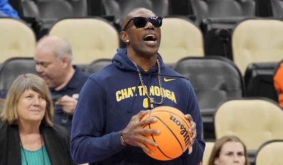 Pro Football Hall of Fame wide receiver Terrell Owens watches as Chattanooga warms up before a college basketball game against Illinois in the first round of the NCAA tournament in Pittsburgh, Friday, March 18, 2022. (AP Photo/Gene J. Puskar) **FILE**