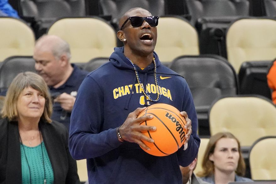 Pro Football Hall of Fame wide receiver Terrell Owens watches as Chattanooga warms up before a college basketball game against Illinois in the first round of the NCAA tournament in Pittsburgh, Friday, March 18, 2022. (AP Photo/Gene J. Puskar) **FILE**