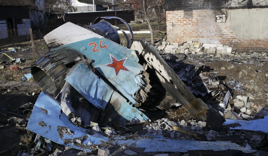 Fragments of a Russian jet fighter on a private house in Chernihiv, Ukraine, Wednesday, April 6, 2022. Russia retreated from areas around Kyiv and the northern cities of Chernihiv and Sumy after talks with Ukraine in Turkey last week. (AP Photo/Stas Yurchenko)